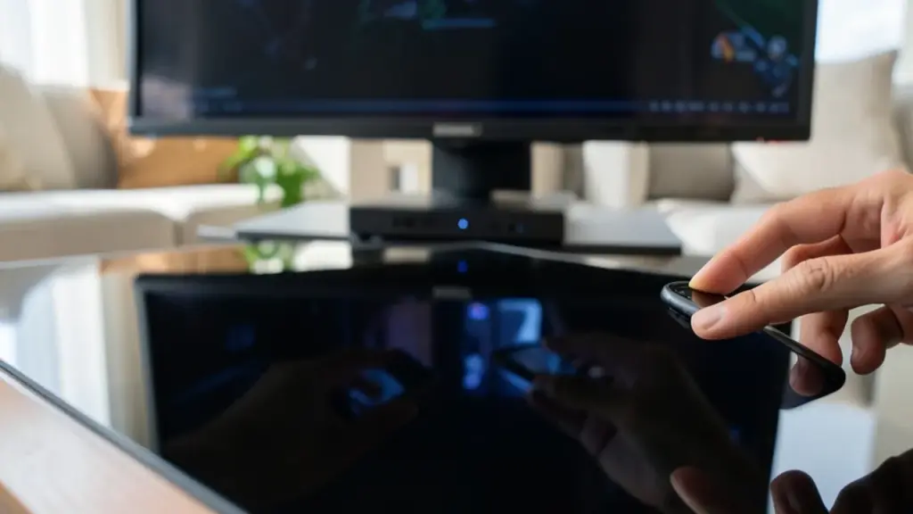 Reflective surface showing players joining a Jackbox night through phones.