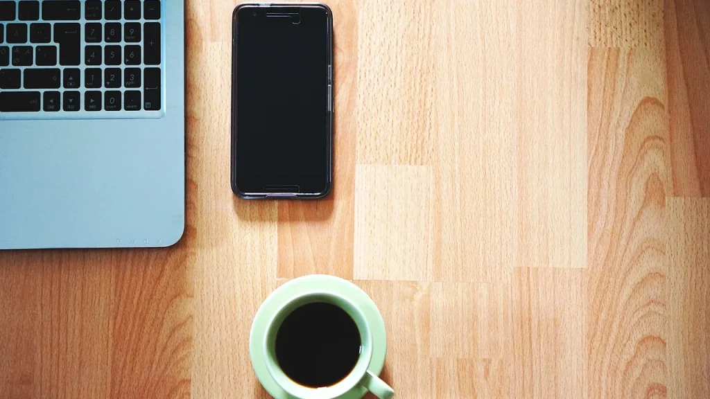 Robot prototype walking on a desk powered by a phone
