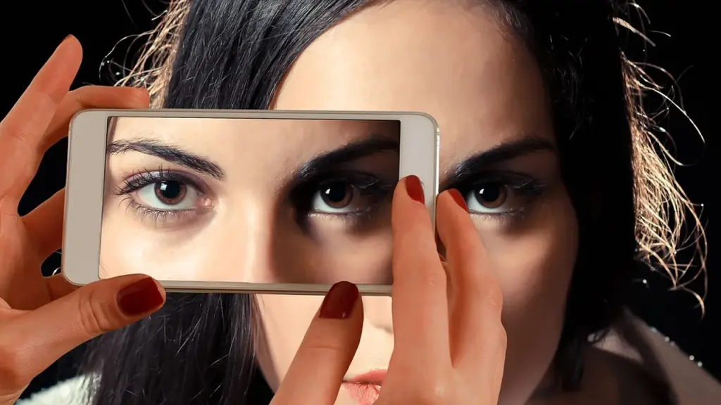 Close up of a smartphone with a chat interface.