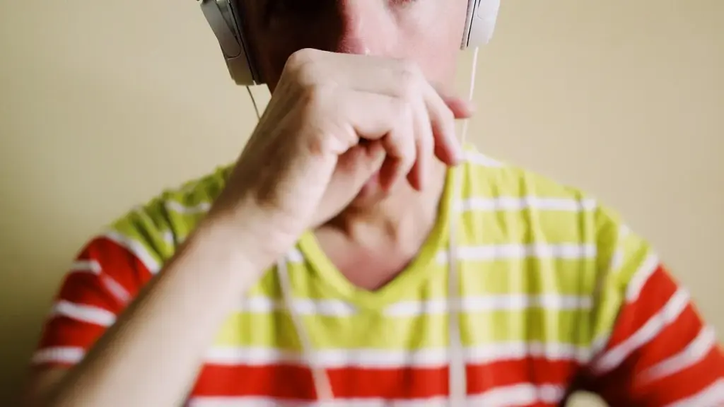 Close-up of a person wearing headphones during a podcast