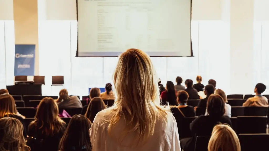 Audience watching a public talk about a tech topic