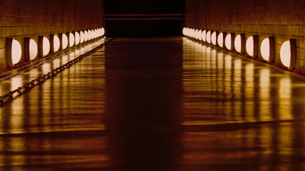 Dimly lit labyrinth corridor with eerie lighting