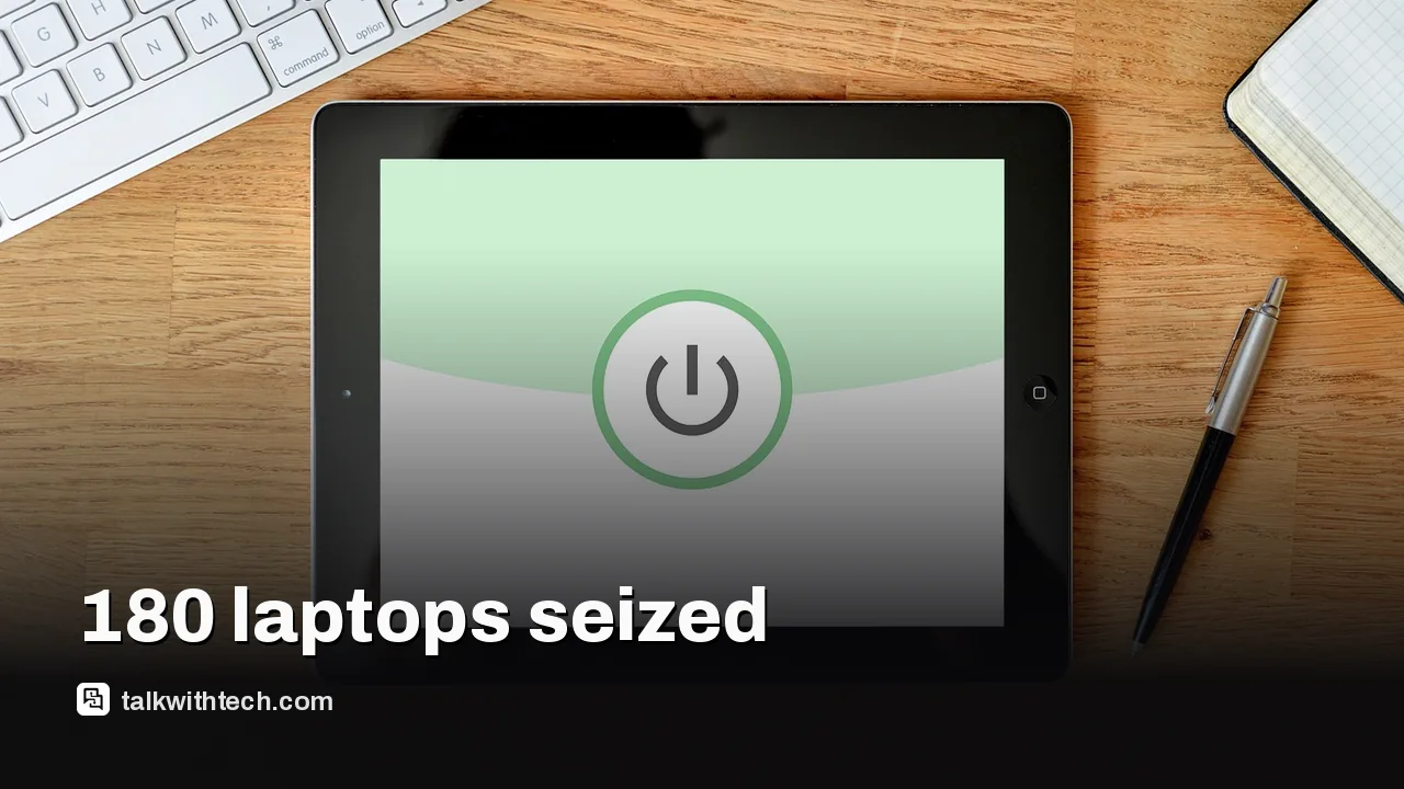 A person working on a laptop with security icons