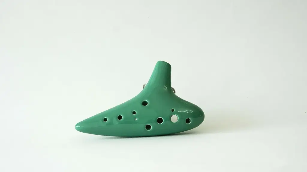 Ocarina flute on green cloth