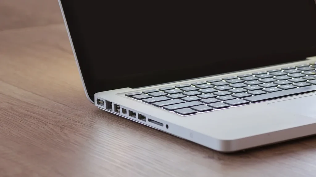 A person using one keyboard to control two computer screens