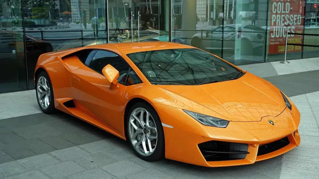 Upscale showroom with a row of luxury cars on display