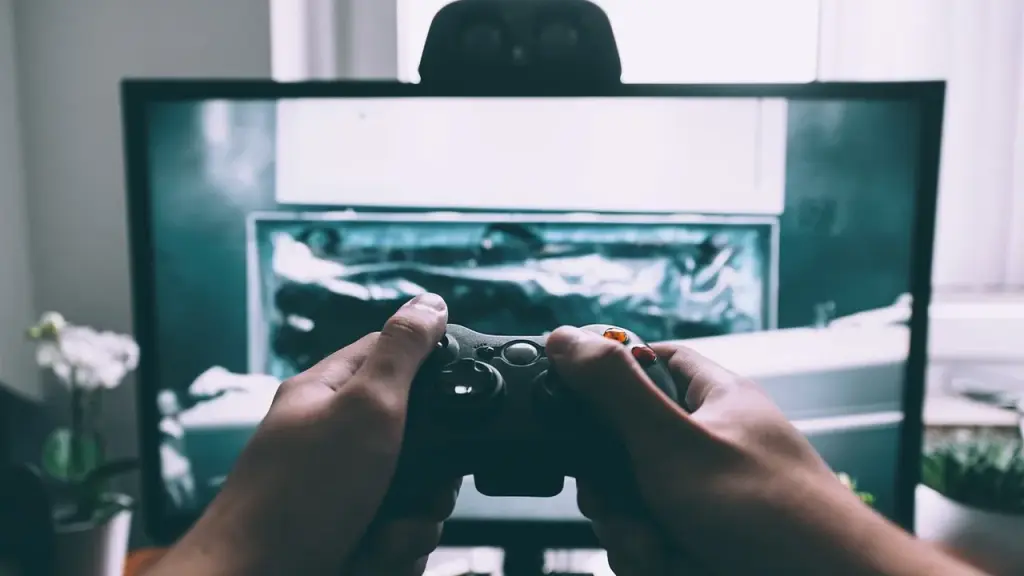 A game controller in front of a TV screen