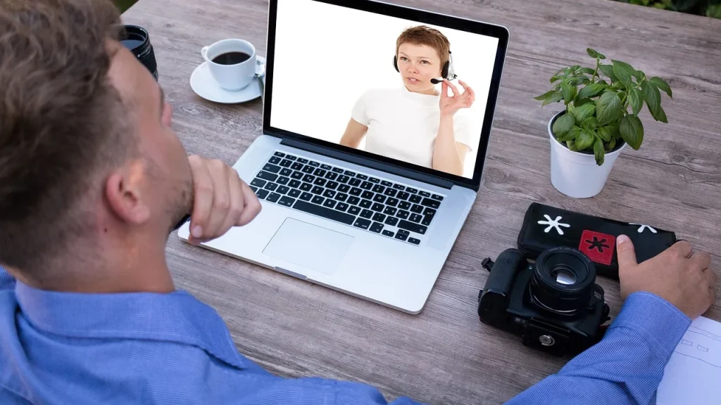 Person in a video call on a laptop