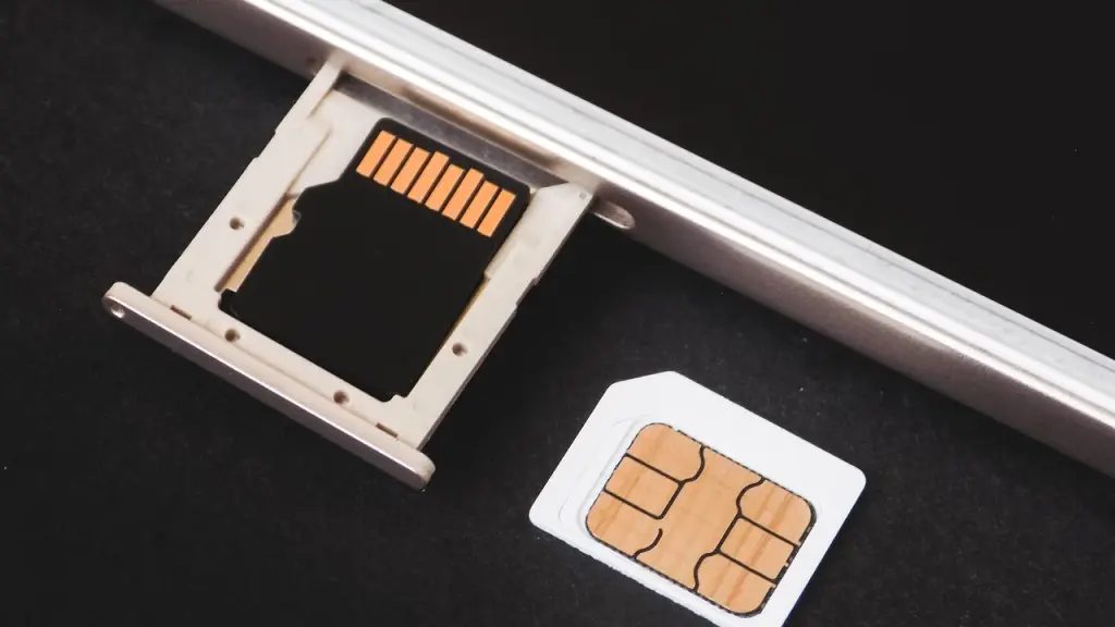 Person removing a SIM tray from a smartphone
