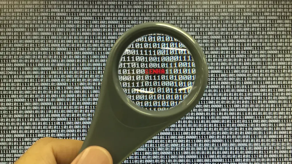 Monitors showing lines of security code in a lab