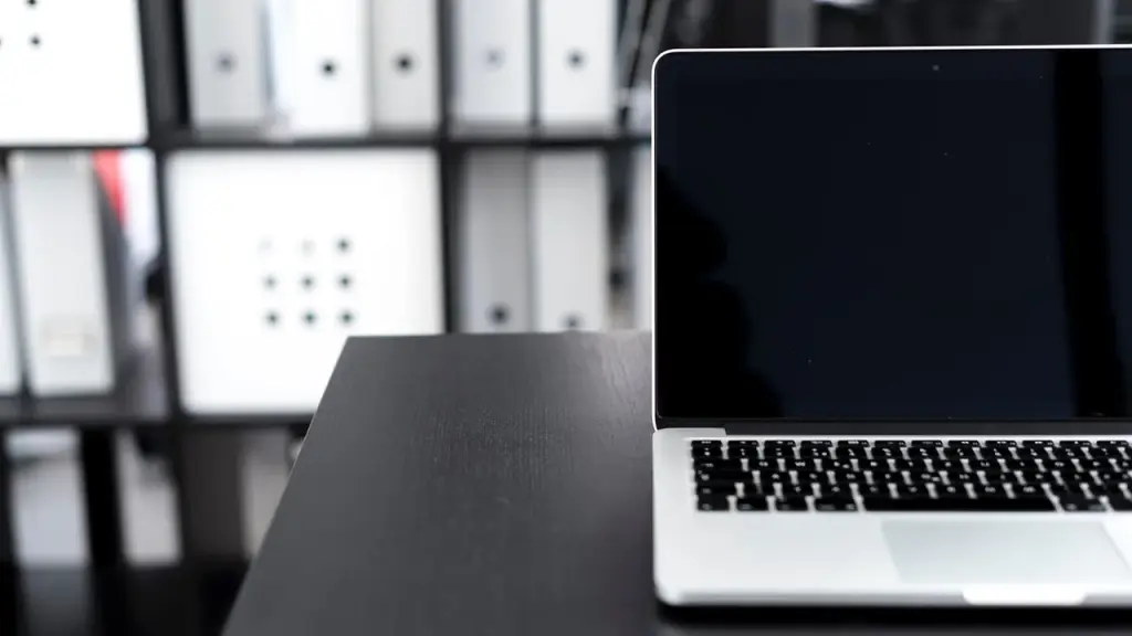 Open plan workspace with computers and collaboration spaces