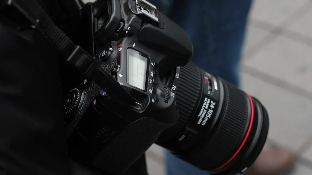 Close-up of a smartphone camera with a magnet nearby