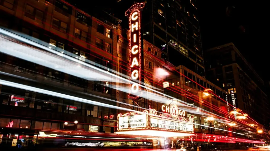 A theater marquee lit up at night signaling a film release