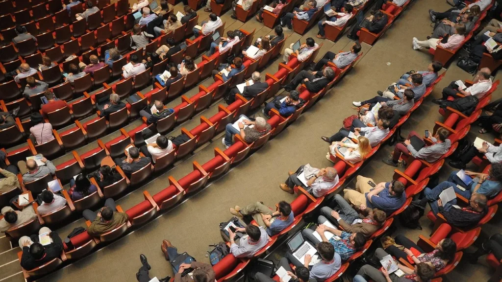 People networking at a large tech conference