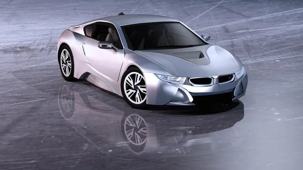 A futuristic electric sports car on a stage at a reveal event