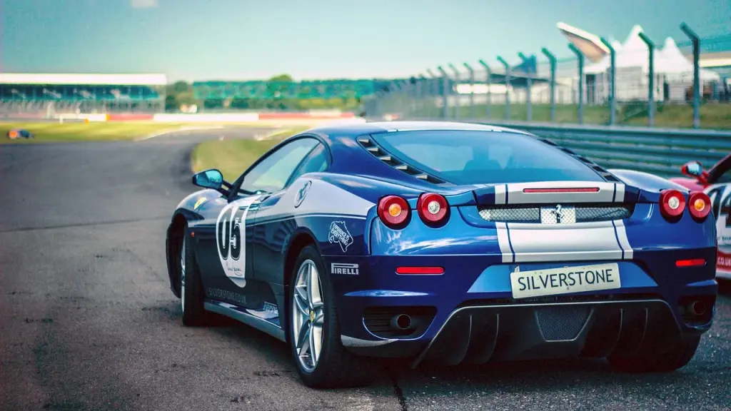 A sleek electric sports car on a race track with motion blur