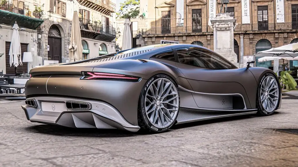 A futuristic electric vehicle on a ramp during a demonstration