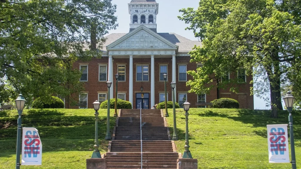 A government building with flags outside, representing federal agencies