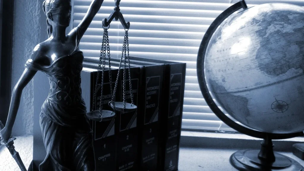 Legal scales beside crypto coins to symbolize justice and crypto theft
