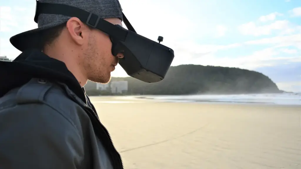 Person operating an FPV drone controller in a cockpit-style setup
