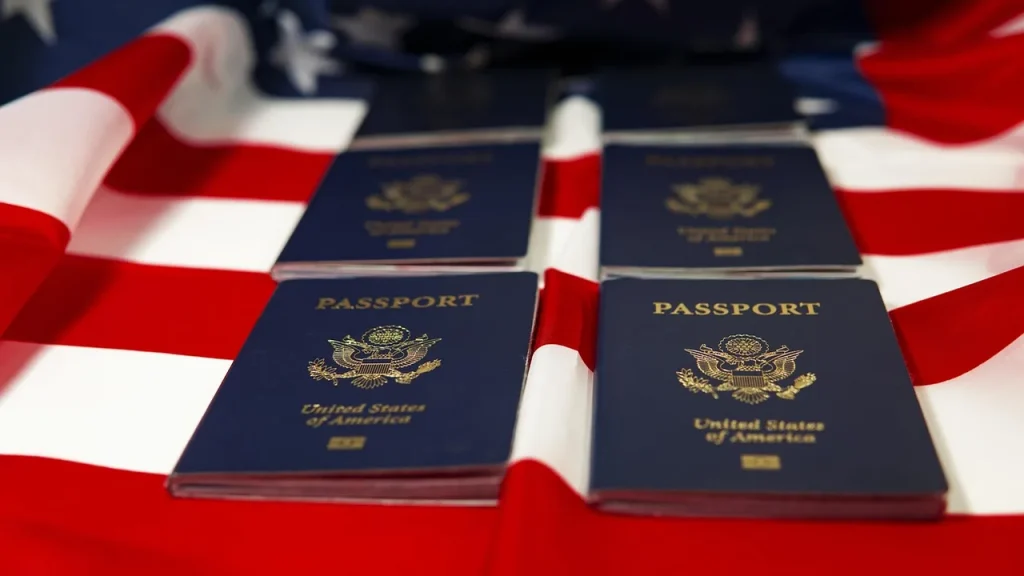 Close-up of immigration documents and stamps on a desk