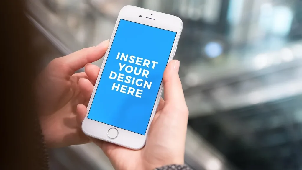 A person holding a smartphone showing app icons on the screen