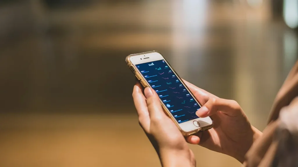 Hands holding a phone with SIM options