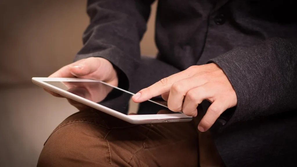 A wearable smart ring on a finger showing a digital readout