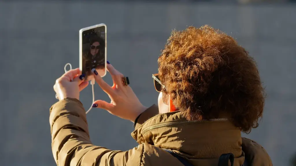 Close-up of a video call screen on a smartphone showing participants