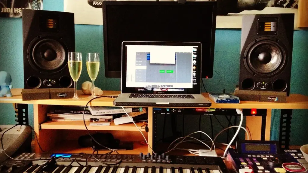 Studio headphones worn while mixing at a computer