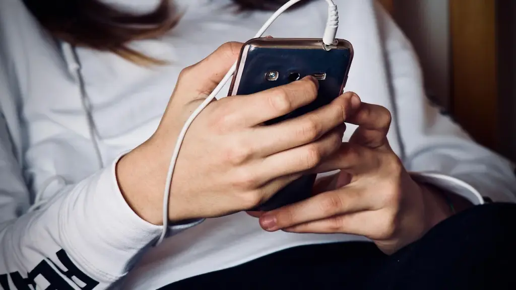 A smartphone with a simple AI app open on the screen