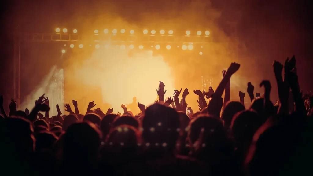 A large crowd watching a live stage event